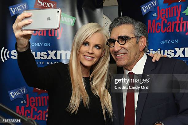 Actor Eugene Levy poses for a photo with host Jenny McCarthy during a visit to 'Dirty, Sexy, Funny with Jenny McCarthy' at the SiriusXM Studios on...