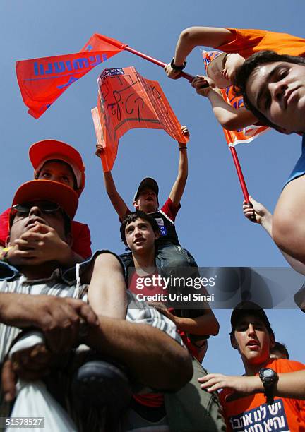 Israeli settlers demonstrate against Israeli Prime Minister Ariel Sharon's Gaza Strip disengagement plan outside the Knesset, Israel's parliament,...