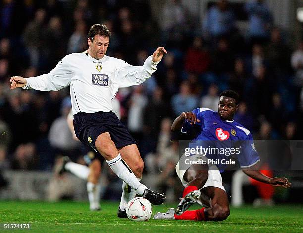 Valery Mezague of Portsmouth tackles Sean Gregan of Leeds during the Carling Cup Third round match between Portsmouth and Leeds United at Fratton...