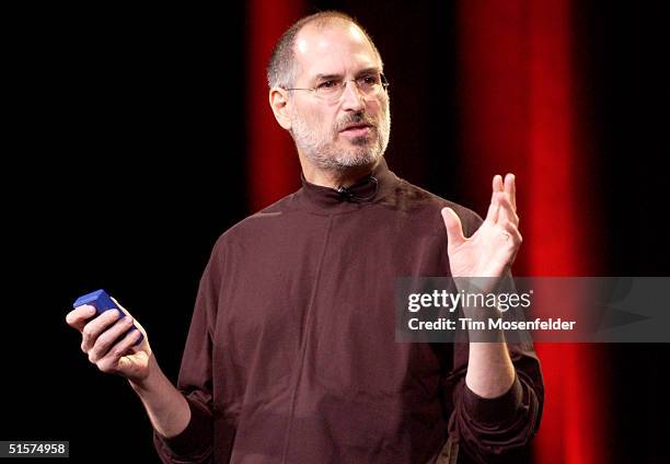 Steve Jobs of Apple Computer celebrates the release of a new Apple iPod family of products at the California Theatre on October 26, 2004 in San Jose,...