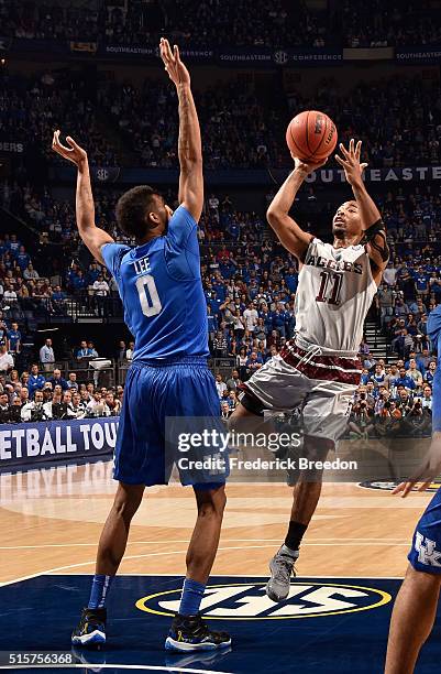 Anthony Collins of the Texas A&M Aggies takes a shot against Marcus Lee of the Kentucky Wildcats during the SEC Basketball Tournament Championship at...