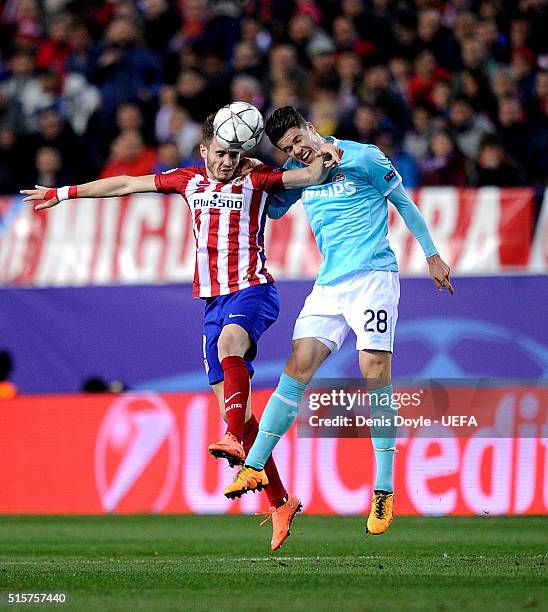 Saul Niguez of Club Atletico de Madrid goes for the ball against Marco van Ginkel of PSV Eindhoven during the UEFA Champions League round of 16...