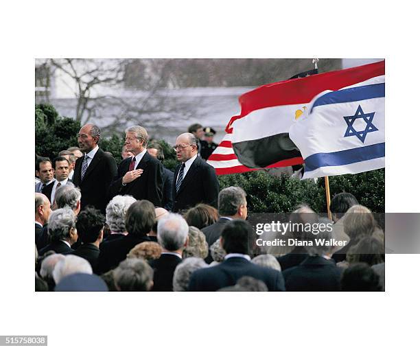 Egyptian President Anwar al-Sadat, United States President Jimmy Carter and Israeli Premier Menachem Begin are photographed before signing the...