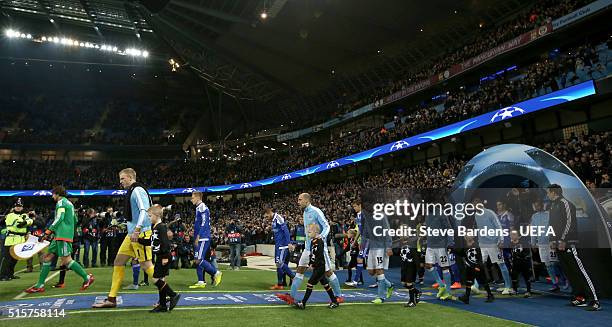 The Manchester City and FC Dynamo Kyiv players walk onto the pitch prior to the UEFA Champions League Round of 16 second leg match between Manchester...