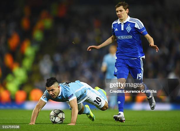 Sergio Aguero of Manchester City is tripped by Denys Garmash of Dynamo Kiev during the UEFA Champions League round of 16 second leg match between...