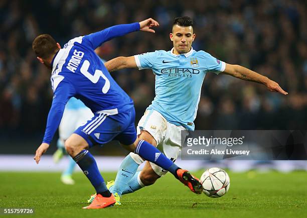 Sergio Aguero of Manchester City is faced by Vitorino Antunes of Dynamo Kiev during the UEFA Champions League round of 16 second leg match between...