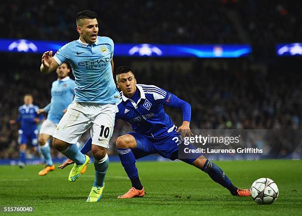 Sergio Aguero of Manchester City battles with Yevhen Khacheridi of Dynamo Kiev during the UEFA Champions League round of 16 second leg match between...