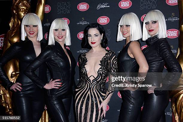 Dita Von Teese poses with dancers during the "Dita Von Teese's Crazy Show" opening night photocall at Le Crazy Horse on March 15, 2016 in Paris,...