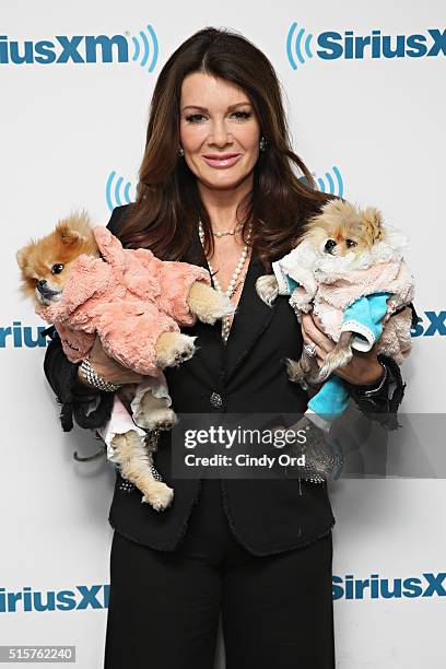 Personality Lisa Vanderpump poses with her dogs Harrison and Giggy during a visit to the SiriusXM Studio on March 15, 2016 in New York City.