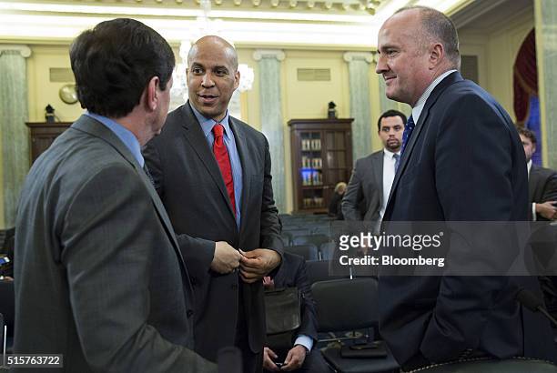 Mike Ableson, vice president of strategy and global portfolio planning at General Motors Co., from left, Senator Cory Booker, a Democrat from New...