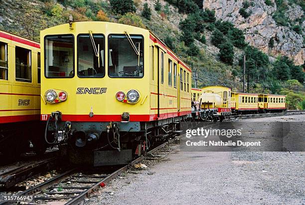 The yellow train of Cerdagne at Villefranche de Conflent station. The Yellow Train cross the territory of the Regional Nature Park of Catalan...