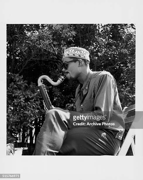 Saxophonist Eric Dolphy performing at 'Tentsville', the rebel camp of musicians established by bassist Charles Mingus in front of the Cliff Walk...