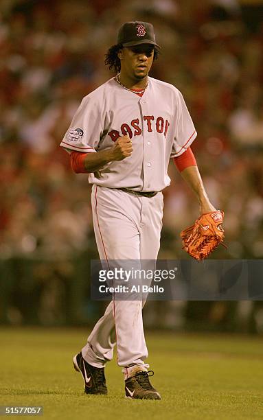 Pedro Martinez of the Boston Red Sox pumps his fist as he walks off the field after ending the inning against the St. Louis Cardinals during game...