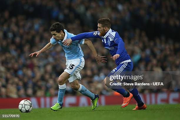 Jesus Navas of Manchester City challenges for the ball with Antunes of FC Dynamo Kyiv during the UEFA Champions League Round of 16 second leg match...