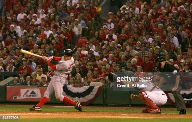 Bill Mueller of the Boston Red Sox hits a RBI single against the St. Louis Cardinals during the fifth inning of game three of the World Series on...