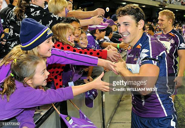 File photo taken on April 25 shows Melbourne Storm rugby league player Billy Slater greeting fans after their match against the New Zealand Warriors...