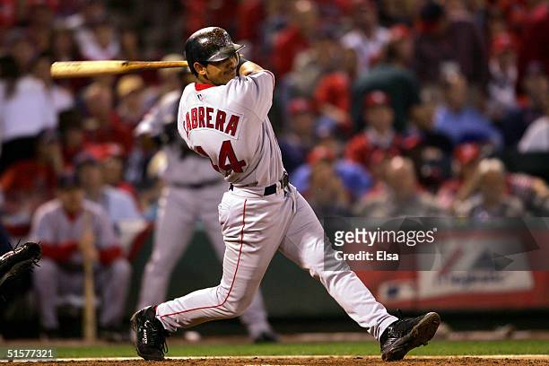 Orlando Cabrera of the Boston Red Sox hits a single in the fifth inning against the St. Louis Cardinals during game three of the World Series on...