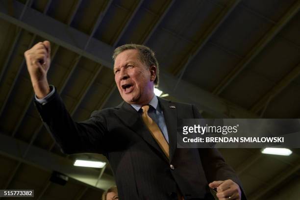 Republican US Presidential hopeful Ohio Governor John Kasich celebrates his Ohio primary victory during voting day rally at Baldwin Wallace...