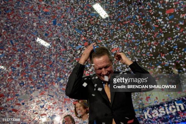 Republican US Presidential hopeful Ohio Governor John Kasich celebrates his Ohio primary victory during voting day rally at Baldwin Wallace...