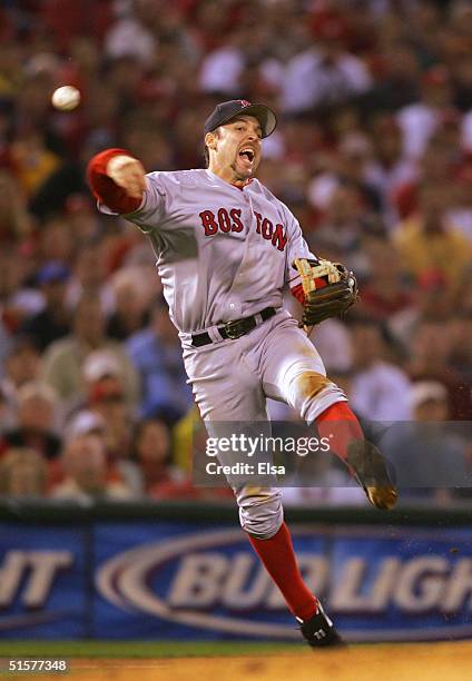 Third baseman Bill Mueller of the Boston Red Sox throws out Scott Rolen of the St. Louis Cardinals in the fourth inning during game three of the...