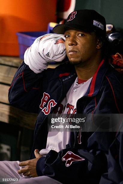 Starting pitcher Pedro Martinez of the Boston Red Sox rests in between innings against the St. Louis Cardinals during game three of the World Series...