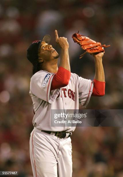 Pedro Martinez of the Boston Red Sox points the sky after being taken out of game three of the World Series against the St. Louis Cardinals on...