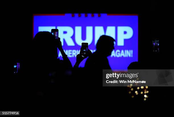 Republican presidential candidate Donald Trump arrives for a primary night press conference at the Mar-A-Lago Club's Donald J. Trump Ballroom March...