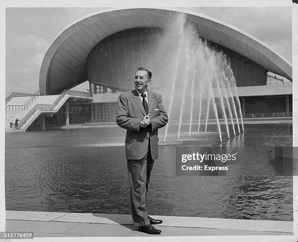 American film producer and animator Walt Disney outside the Haus der Kulturen der Welt in the Tiergarten, Berlin, circa 1958. The building was...