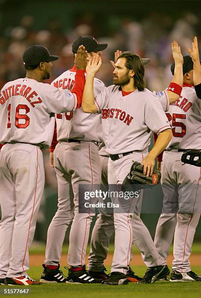 Johnny Damon and the Boston Red Sox team celebrate after defeating the St. Louis Cardinals 4-1 in game three of the World Series on October 26, 2004...