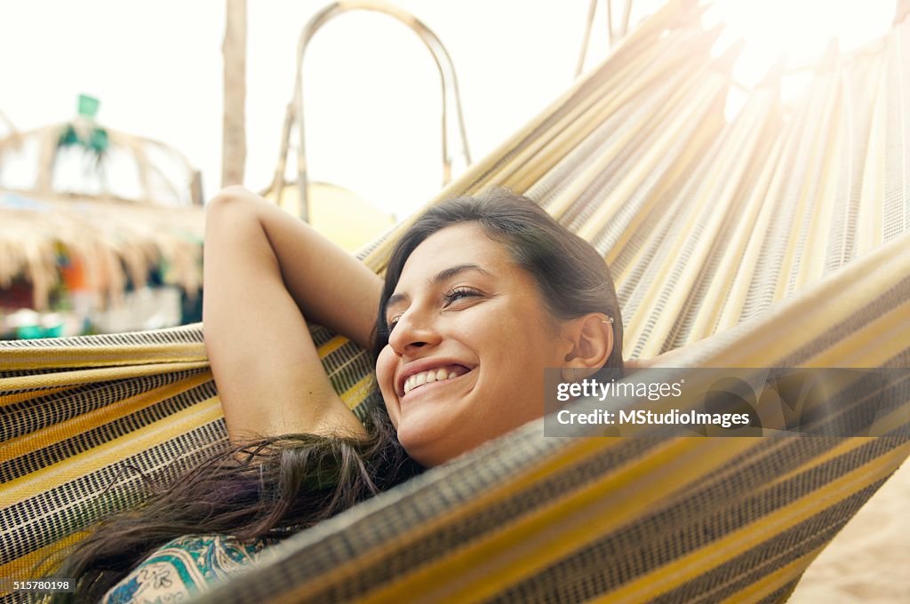 Beautiful woman resting on hammock