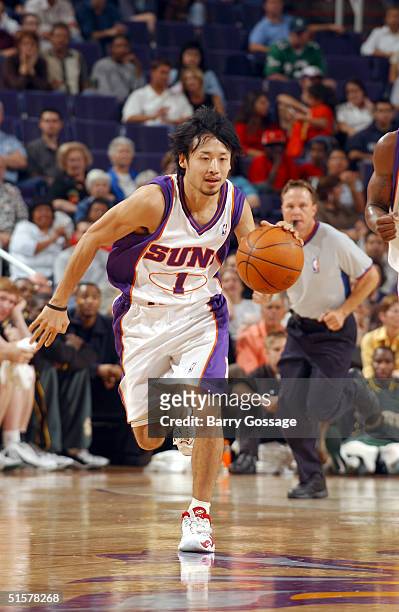 Yuta Tabuse of the Phoenix Suns drives against the Seattle SuperSonics on October 26, 2004 at America West Arena in Phoenix, Arizona. NOTE TO USER:...