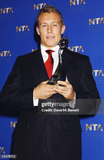 England Rugby player Jonny Wilkinson poses in the Awards Room with the award for Sporting Moment at the "10th Anniversary National Television Awards"...