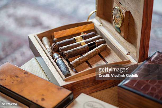 high angle view of cigars in wooden box on table - cigar ストックフォトと画像