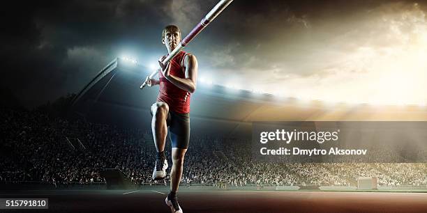 male pole vaulting athlete - pole vault stock pictures, royalty-free photos & images