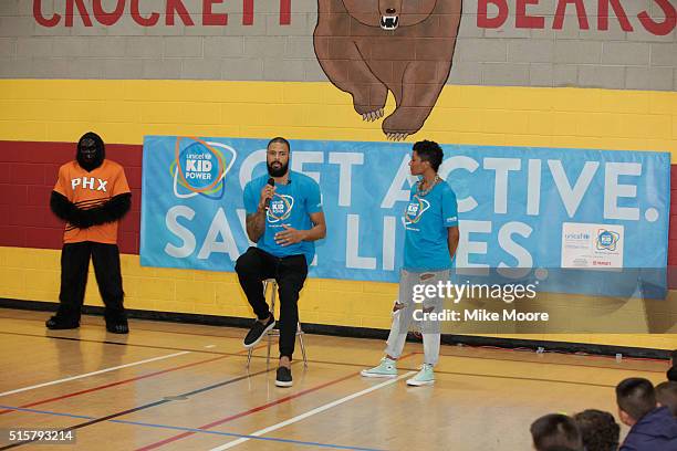 Player Tyson Chandler talks to the students as the Phoenix Suns Gorilla and Kimberly Chandler watch at the UNICEF Kid Power Phoenix Celebration at...