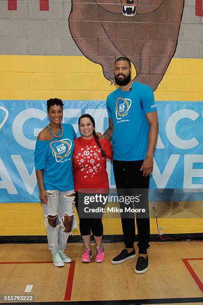 Kimberly and NBA Player Tyson Chandler pose with a Target Volunteer at the UNICEF Kid Power Phoenix Celebration at David Crockett Elementary School...