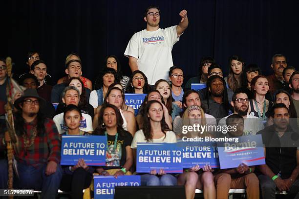 Attendees listen as Senator Bernie Sanders, an independent from Vermont and 2016 Democratic presidential candidate, not pictured, speaks during a...