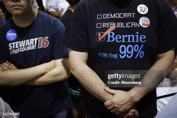 Attendees listen as Senator Bernie Sanders, an independent from Vermont and 2016 Democratic presidential candidate, not pictured, speaks during a...