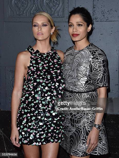 Actors Teresa Palmer and Freida Pinto arrive at the premiere of Broad Green Pictures' 'Knight Of Cups' on March 1, 2016 in Los Angeles, California.