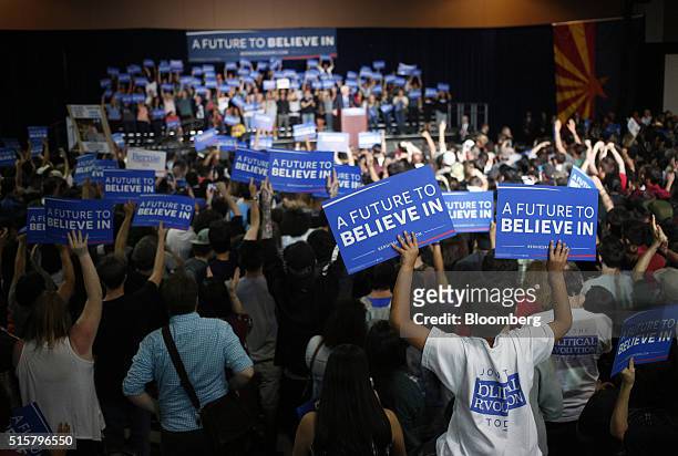Attendees cheer during a campaign event for Senator Bernie Sanders, an independent from Vermont and 2016 Democratic presidential candidate, not...