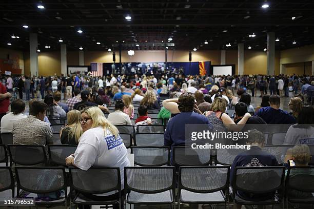 Attendees wait for the start of a campaign event for Senator Bernie Sanders, an independent from Vermont and 2016 Democratic presidential candidate,...
