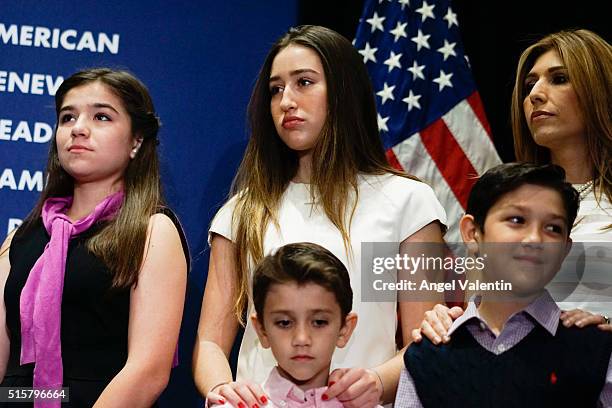 The family of Republican presidential candidate U.S. Senator Marco Rubio listens as he addresses supporters at a primary night rally on March 15,...