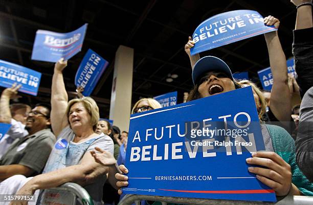 Members of the crowd show their support for Democratic presidential candidate Sen. Bernie Sanders at the Phoenix Convention Center during a campaign...