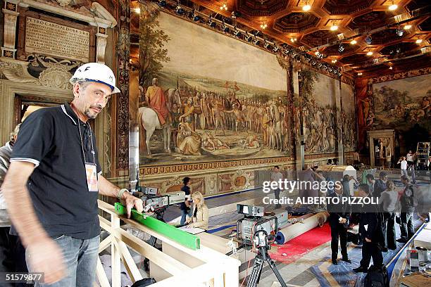 Men work inside the The Orazi and Curiazi Hall at the Capitol place in Rome, 27 October 2004. The Capitol will host Heads of State and Government and...