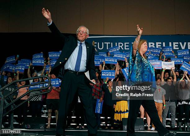 Democratic presidential candidate Sen. Bernie Sanders and his wife Jane wave to the crowd at the Phoenix Convention Center during a campaign rally on...