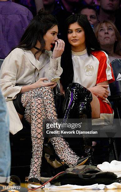 Kendall Jenner and sister Kylie Jenner attend an NBA basketball game between the Los Angeles Lakers and Sacramento Kings at Staples Center March 15,...