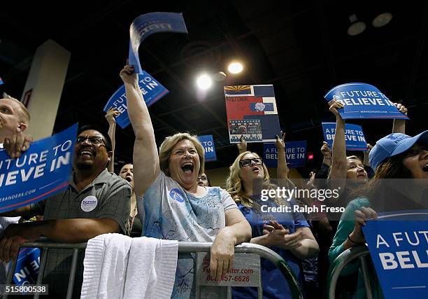 Members of the crowd show their support for Democratic presidential candidate Sen. Bernie Sanders at the Phoenix Convention Center during a campaign...