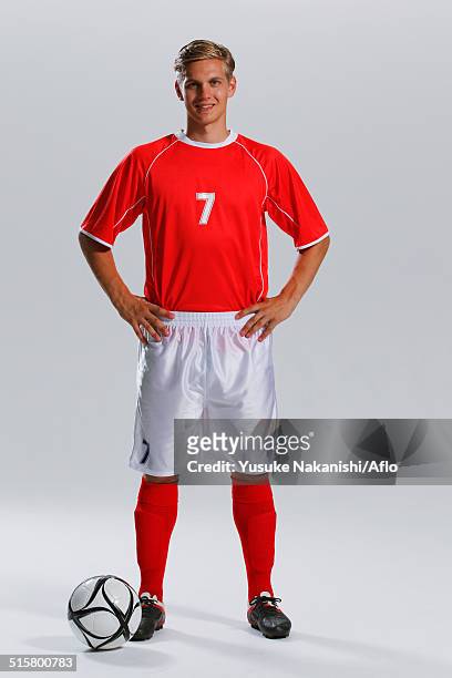 soccer player standing with ball - trikot stock-fotos und bilder