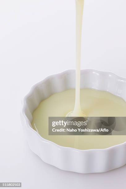 condensed milk - condensed milk foto e immagini stock