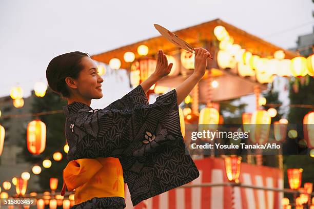 young japanese woman in a traditional kimono at a summer festival - traditional festival bildbanksfoton och bilder